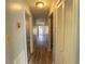 Long hallway with light wood floors and built-in storage at 967 Metropolitan Sw Pkwy, Atlanta, GA 30310