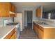 Kitchen with light oak cabinets and a gas stove at 967 Metropolitan Sw Pkwy, Atlanta, GA 30310