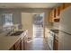 Kitchen with oak cabinets and door to backyard at 967 Metropolitan Sw Pkwy, Atlanta, GA 30310