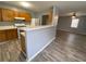 Kitchen features a breakfast bar, wood cabinets, and light gray walls at 967 Metropolitan Sw Pkwy, Atlanta, GA 30310