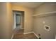 This laundry room features space for a washer and dryer and built-in shelving at 967 Metropolitan Sw Pkwy, Atlanta, GA 30310