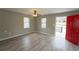 Inviting living room with durable wood-look floors, neutral paint, ceiling fan and abundant natural light at 967 Metropolitan Sw Pkwy, Atlanta, GA 30310