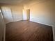 Bedroom with dark brown wood-look flooring and two doors at 1168 Dogwood Nw Ct, Conyers, GA 30012