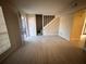 Spacious living room with gray tile floors and view of staircase at 1168 Dogwood Nw Ct, Conyers, GA 30012