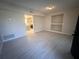 Living room with light gray tile floors and built-in shelving at 1168 Dogwood Nw Ct, Conyers, GA 30012