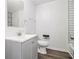 Clean bathroom with gray vanity and bathtub at 125 Clayton St, Fairburn, GA 30213