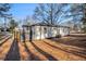 Rear view of a charming single story home with a modern fenced patio at 125 Clayton St, Fairburn, GA 30213