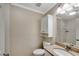 Well-lit bathroom with a granite countertop, ample storage, and a mirror reflecting a tiled shower at 1094 Old Roswell Rd, Roswell, GA 30076