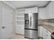 Updated kitchen showcasing stainless steel refrigerator and plenty of cabinet space at 1094 Old Roswell Rd, Roswell, GA 30076