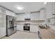 Bright, modern kitchen with stainless steel appliances, granite countertops, and ample cabinet space at 1094 Old Roswell Rd, Roswell, GA 30076