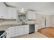 Well-lit kitchen with white cabinets, stainless steel appliances, and tile backsplash providing an inviting atmosphere at 1094 Old Roswell Rd, Roswell, GA 30076