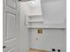 Practical laundry room with shelving offering organized space for laundry essentials at 1094 Old Roswell Rd, Roswell, GA 30076