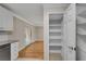 Convenient pantry with ample shelving for organized storage, seamlessly connected to the bright kitchen space at 1094 Old Roswell Rd, Roswell, GA 30076