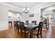 Elegant dining room with hardwood floors, a chandelier, and seating for six at 2344 Saint Davids Nw Sq # 2, Kennesaw, GA 30152