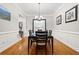 Formal dining room with hardwood floors, chandelier, and wainscoting at 2344 Saint Davids Nw Sq # 2, Kennesaw, GA 30152