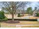 Landscaped front yard with a view of a golf course at 2344 Saint Davids Nw Sq # 2, Kennesaw, GA 30152