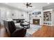 Relaxing living room featuring hardwood floors, fireplace, and built-in shelving at 2344 Saint Davids Nw Sq # 2, Kennesaw, GA 30152