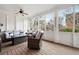 Cozy screened porch with wicker furniture and a view of the backyard at 2344 Saint Davids Nw Sq # 2, Kennesaw, GA 30152