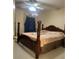 Large bedroom with ceiling fan and post bed at 240 Flowers Cove Ln, Lilburn, GA 30047