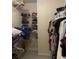 Large walk-in closet with ample shelving and hanging space at 240 Flowers Cove Ln, Lilburn, GA 30047