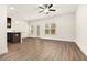 Spacious living room with hardwood floors and ceiling fan at 11112 Benton Woods Dr, Covington, GA 30014