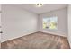 Simple bedroom with neutral walls and carpet flooring at 12 Flower Petal Way, Dacula, GA 30019