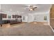 Open kitchen boasts dark cabinetry, granite counters, and an island at 12 Flower Petal Way, Dacula, GA 30019