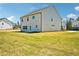 Expansive backyard with lush green lawn offers plenty of space for outdoor activities at 7293 Eton Ln, Locust Grove, GA 30248