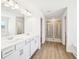 Elegant bathroom with double vanity, quartz countertop, and glass-enclosed shower, creating a spa-like experience at 7293 Eton Ln, Locust Grove, GA 30248
