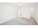 Bright bedroom with neutral carpet and access to a closet, providing a comfortable and functional space at 7293 Eton Ln, Locust Grove, GA 30248