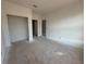 Unfinished bedroom with door to another room at 7293 Eton Ln, Locust Grove, GA 30248