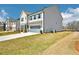 Exterior view of a two-story home with a large yard at 7293 Eton Ln, Locust Grove, GA 30248