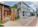 Attractive commercial building featuring a patio with outside seating and greenery around the entrance at 7293 Eton Ln, Locust Grove, GA 30248