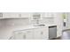 Close-up of the kitchen featuring countertops, sink, and stainless steel dishwasher at 7293 Eton Ln, Locust Grove, GA 30248