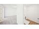 Laundry room includes laminate floors, hookups, wire shelving, and white walls at 7293 Eton Ln, Locust Grove, GA 30248