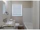 Clean bathroom, granite countertop, and white tile at 1851 Ridgeland Dr, Decatur, GA 30032