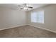 Spacious bedroom with ceiling fan and neutral carpeting at 1851 Ridgeland Dr, Decatur, GA 30032