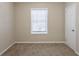 Simple bedroom with window, closet, and neutral wall paint at 1851 Ridgeland Dr, Decatur, GA 30032