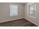 Bedroom with vinyl plank flooring and two windows at 1851 Ridgeland Dr, Decatur, GA 30032