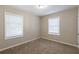 Cozy bedroom with two windows and neutral decor at 1851 Ridgeland Dr, Decatur, GA 30032