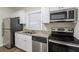 Updated kitchen with stainless steel appliances and granite countertops at 1851 Ridgeland Dr, Decatur, GA 30032