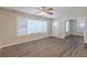 Living room with ceiling fan and vinyl plank flooring, open to other rooms at 1851 Ridgeland Dr, Decatur, GA 30032