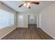 Living room with ceiling fan and vinyl plank flooring, open to other rooms at 1851 Ridgeland Dr, Decatur, GA 30032