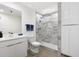 Modern bathroom with white vanity, toilet and large walk-in shower at 505 Whitehall Sw St # 101, Atlanta, GA 30303