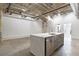 Open concept kitchen with island and exposed ductwork at 505 Whitehall Sw St # 101, Atlanta, GA 30303