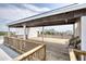 Rooftop deck with wooden flooring, pergola, and city views at 505 Whitehall Sw St # 101, Atlanta, GA 30303