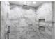 Modern shower with gray marble tile, double shower heads, and built-in shelves at 505 Whitehall Sw St # 101, Atlanta, GA 30303