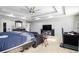 Spacious main bedroom with sitting area and large TV at 7705 Sylvaner Ln, Atlanta, GA 30349