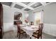 Bright dining room features a table with seating for six and an open concept to the kitchen at 7705 Sylvaner Ln, Atlanta, GA 30349