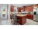 Spacious kitchen island with granite countertop and breakfast bar seating at 7705 Sylvaner Ln, Atlanta, GA 30349